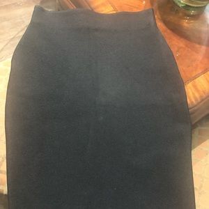 Brand new. Fitted, black skirt.